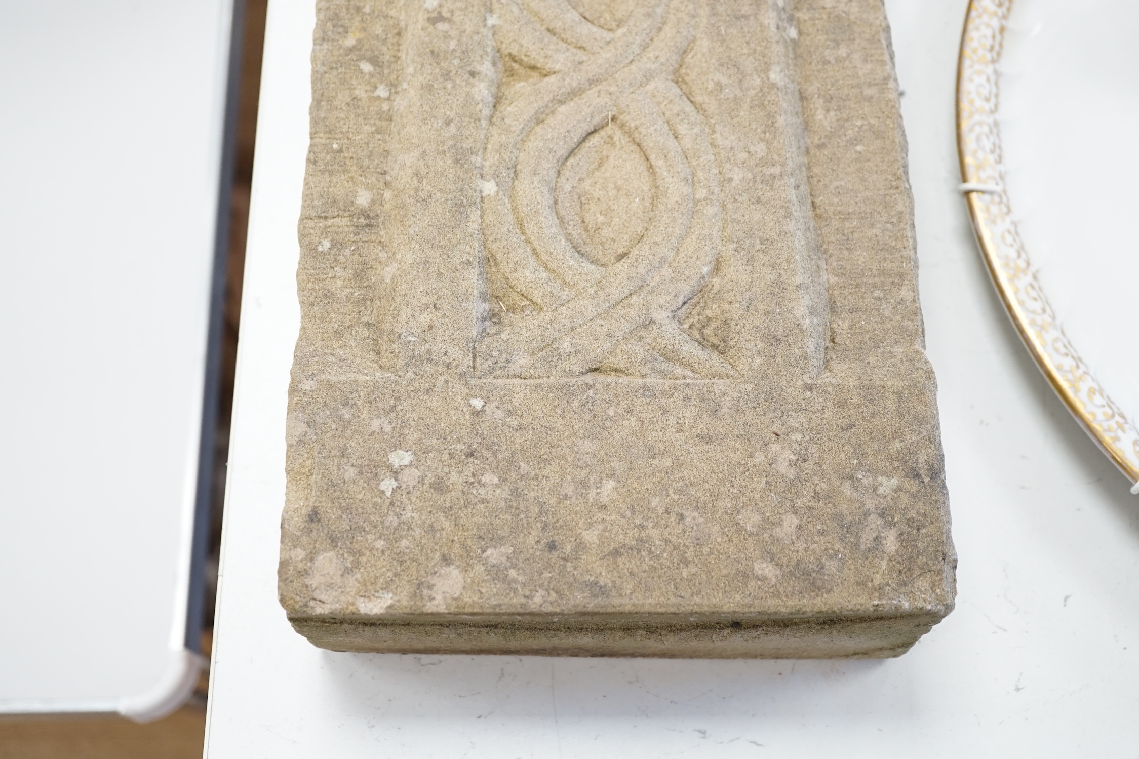 A carved stone Celtic cross, 56 x 18cm. Condition - good